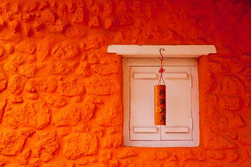home decor white and orange lantern wall